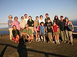 Galapagos 6-2-20 Bartolome Charlotte Ryan, Peter Ryan, Jerome Ryan And Our Team From The Top Of The Spatter Cone Charlotte Ryan, Peter Ryan, Jerome Ryan and the rest of our team pose at the summit of Bartolome in the Galapagos Islands at sunset. Our Naturalist Guide, Johnny Romero, is also in the picture � well, at least his shadow is.